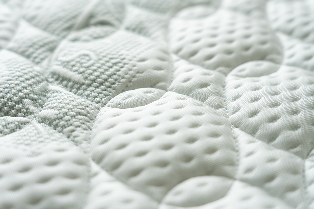Cool Silk premium texture detail — Twin Magnetic Sleep System